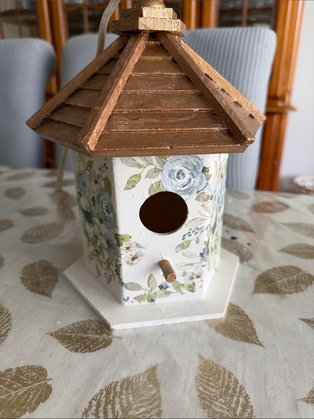White Birdhouse with Gold Roof and Blue Floral Accents wooden